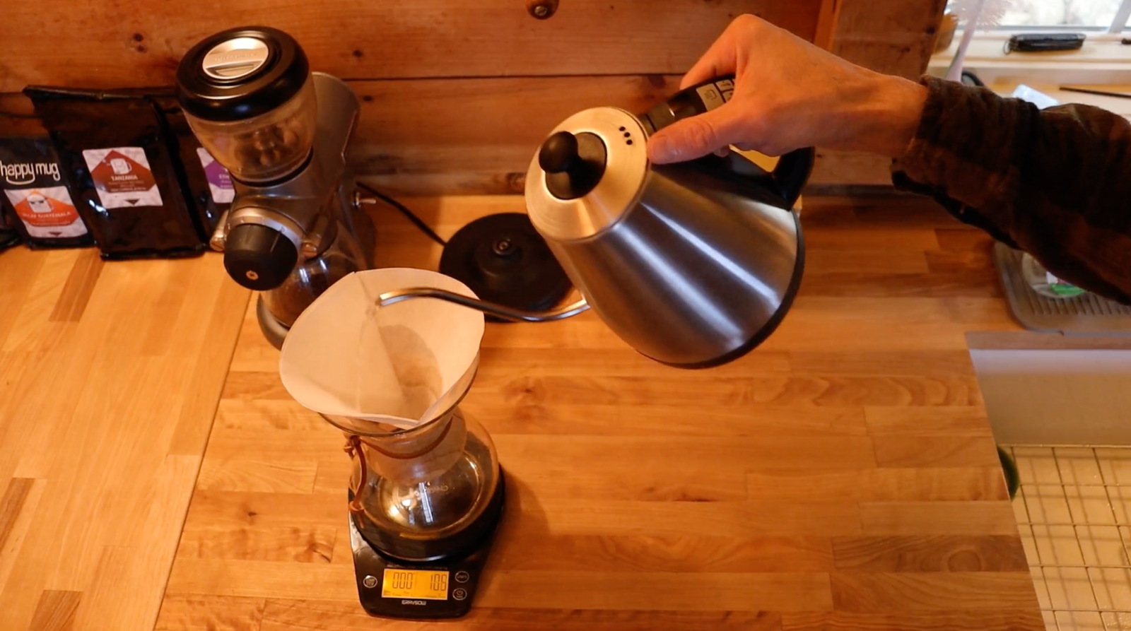 pouring water in a chemex coffee filter