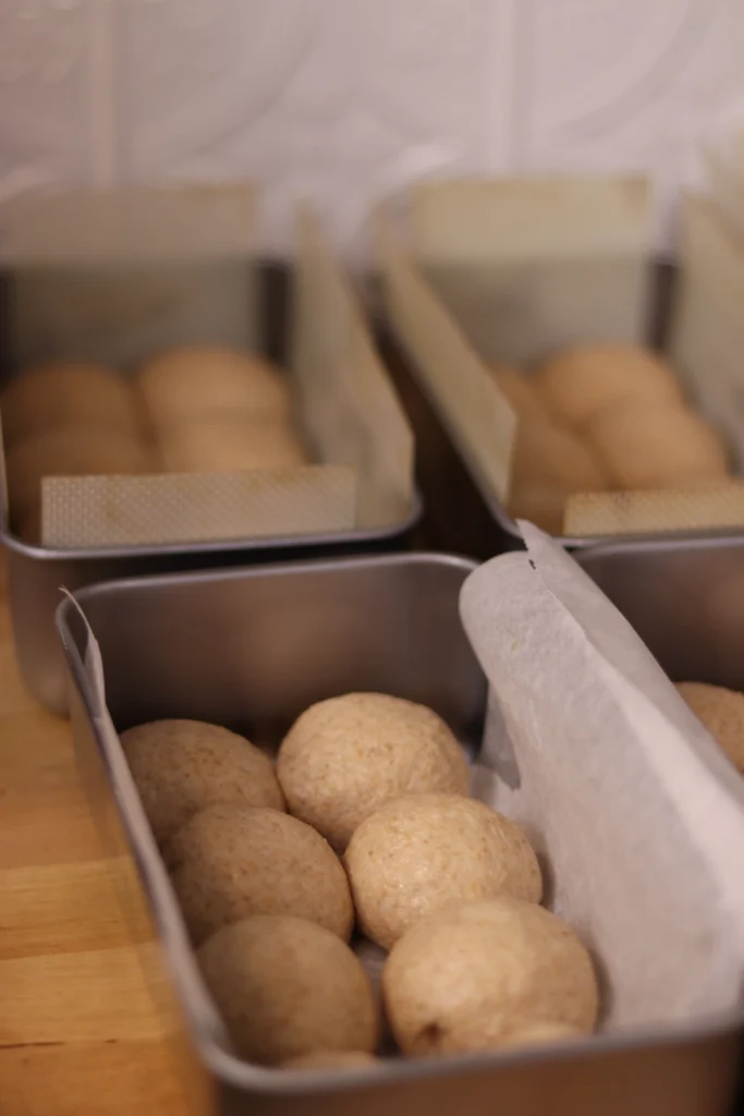 dough balls in bread pans