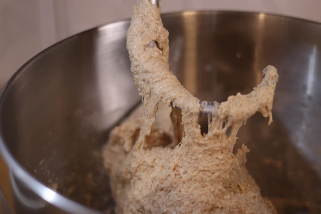 dough falling off a dough hook in a stand mixer
