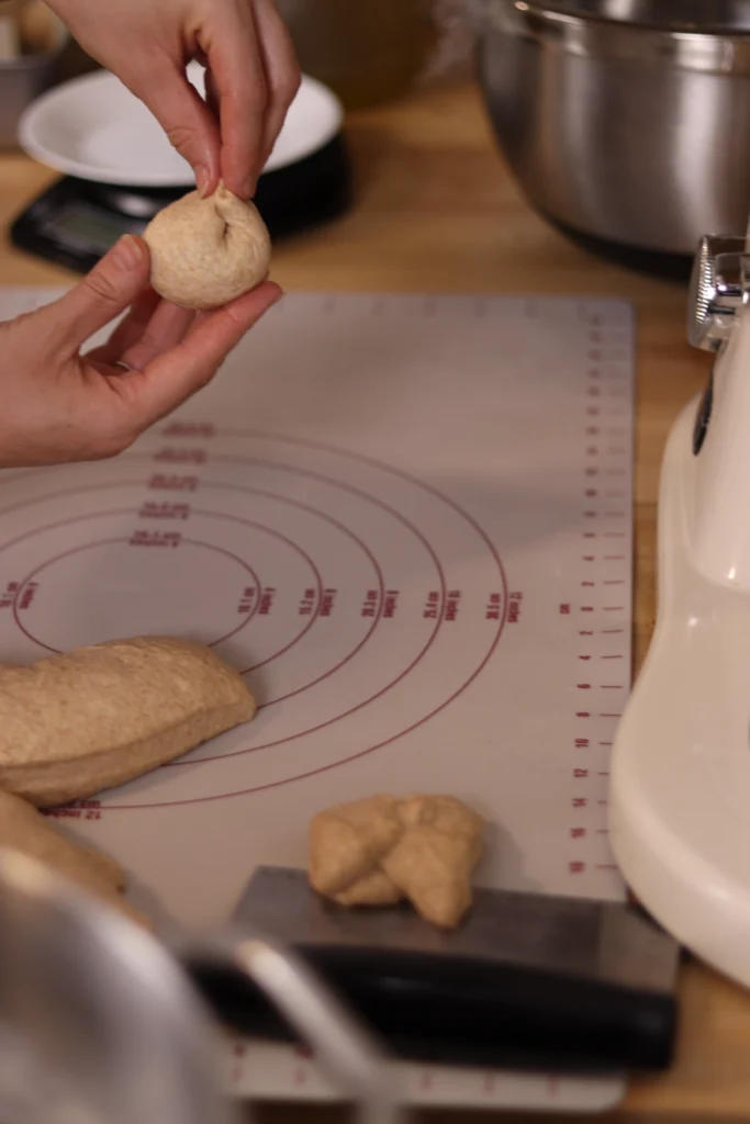 pinching dough to create a ball
